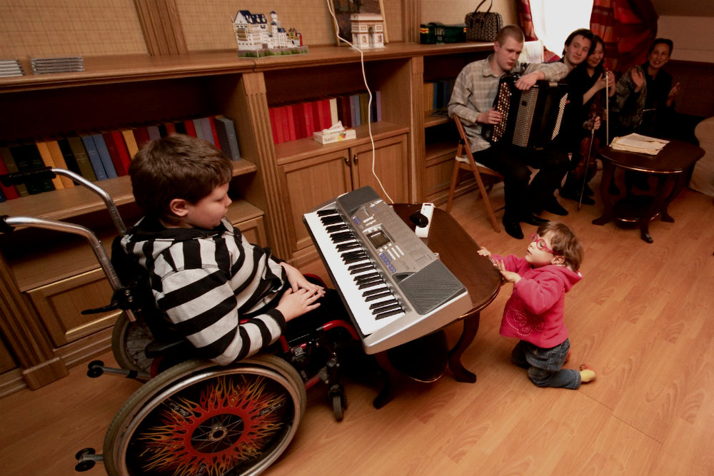 Hospice patient Gavrila plays electric piano